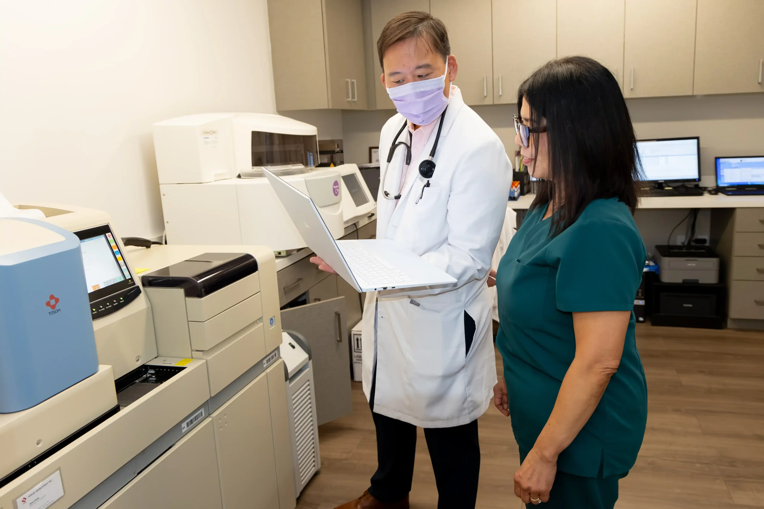 Dr. Ho and a staff member.