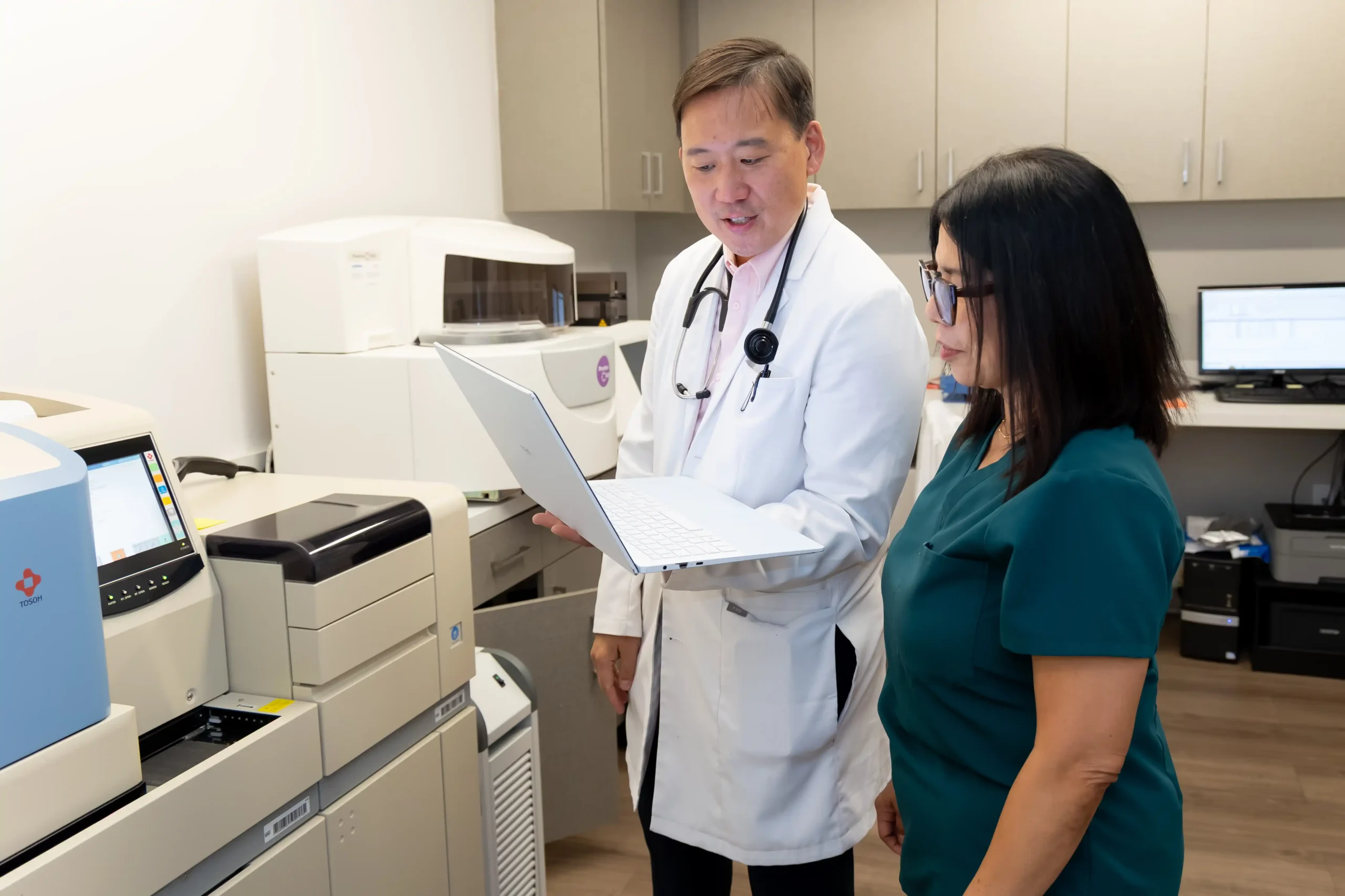 Dr. Ho and a staff member.